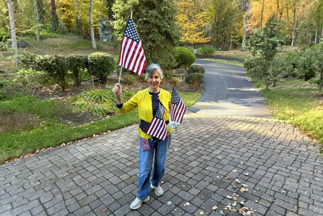 Helene Rubin, a patient in the daraxonrasib pancreatic cancer trial, photographed outdoors with American flags