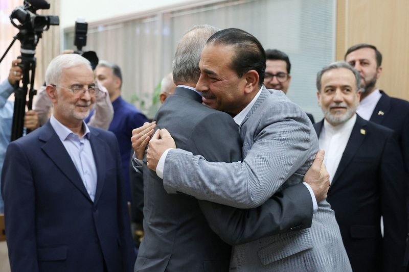 Pakistani Field Marshal Asim Munir embraces Iranian President Masoud Pezeshkian during a meeting in Tehran.