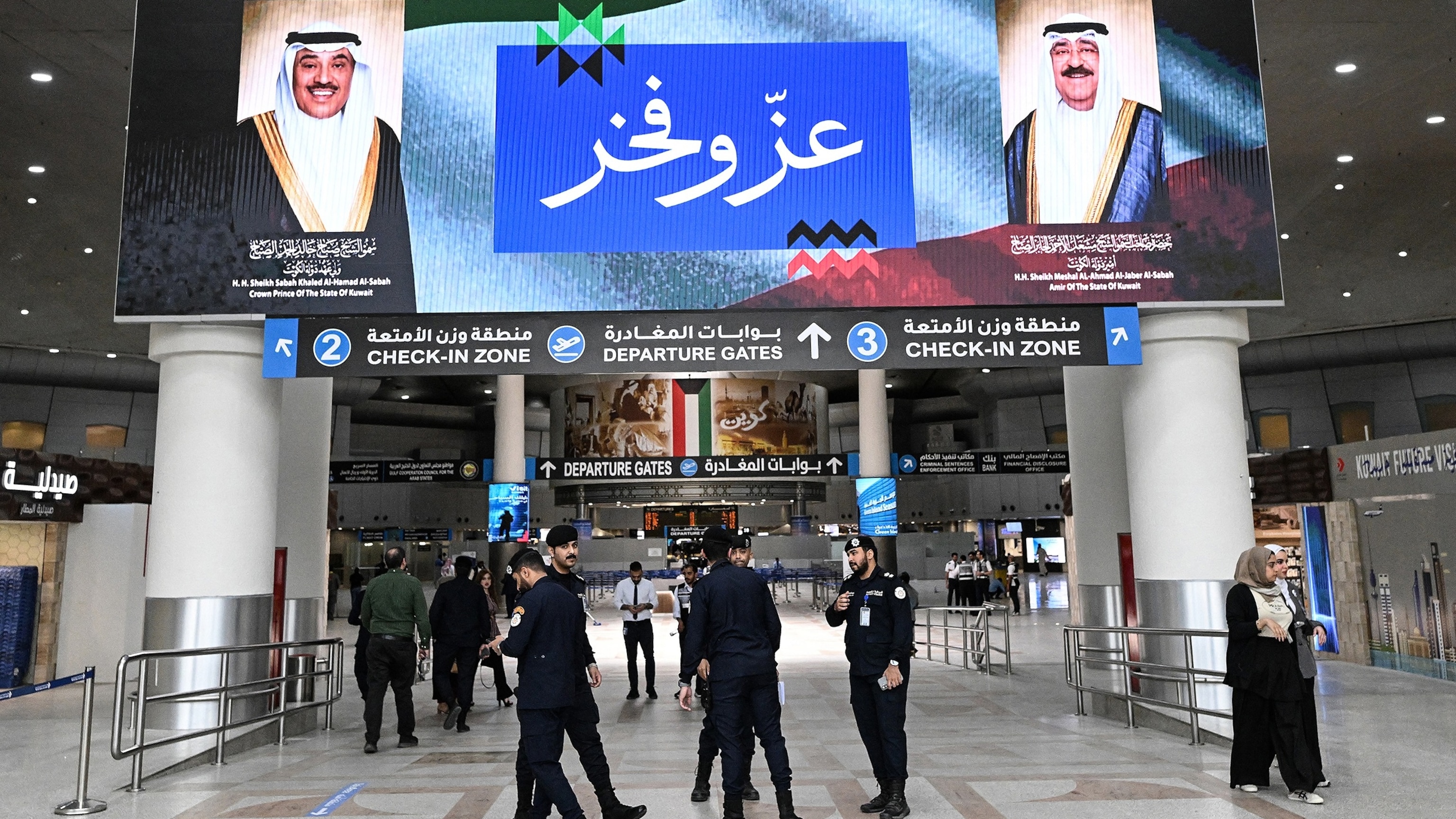 Kuwaiti police and security personnel inside Kuwait International Airport after the Iranian strike