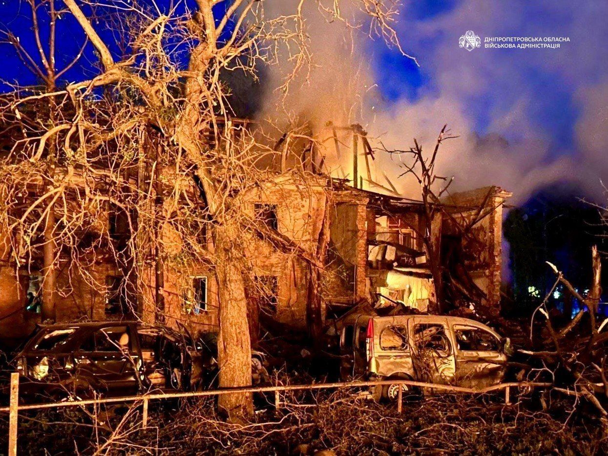 Burnt apartment building and destroyed vehicles in Dnipro after the Russian overnight strike.