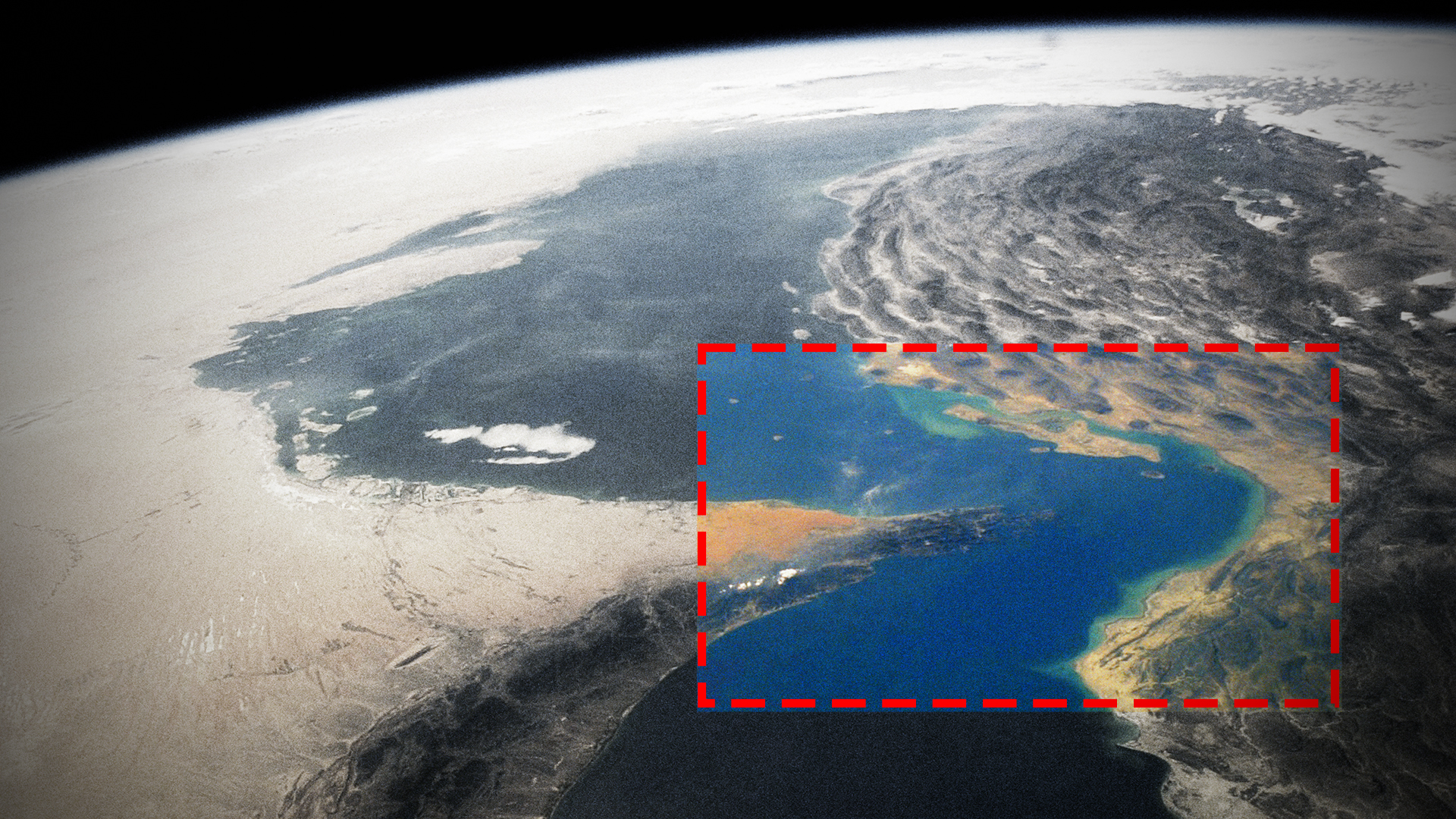Satellite view of the Persian Gulf with the Strait of Hormuz outlined in a red dashed rectangle.